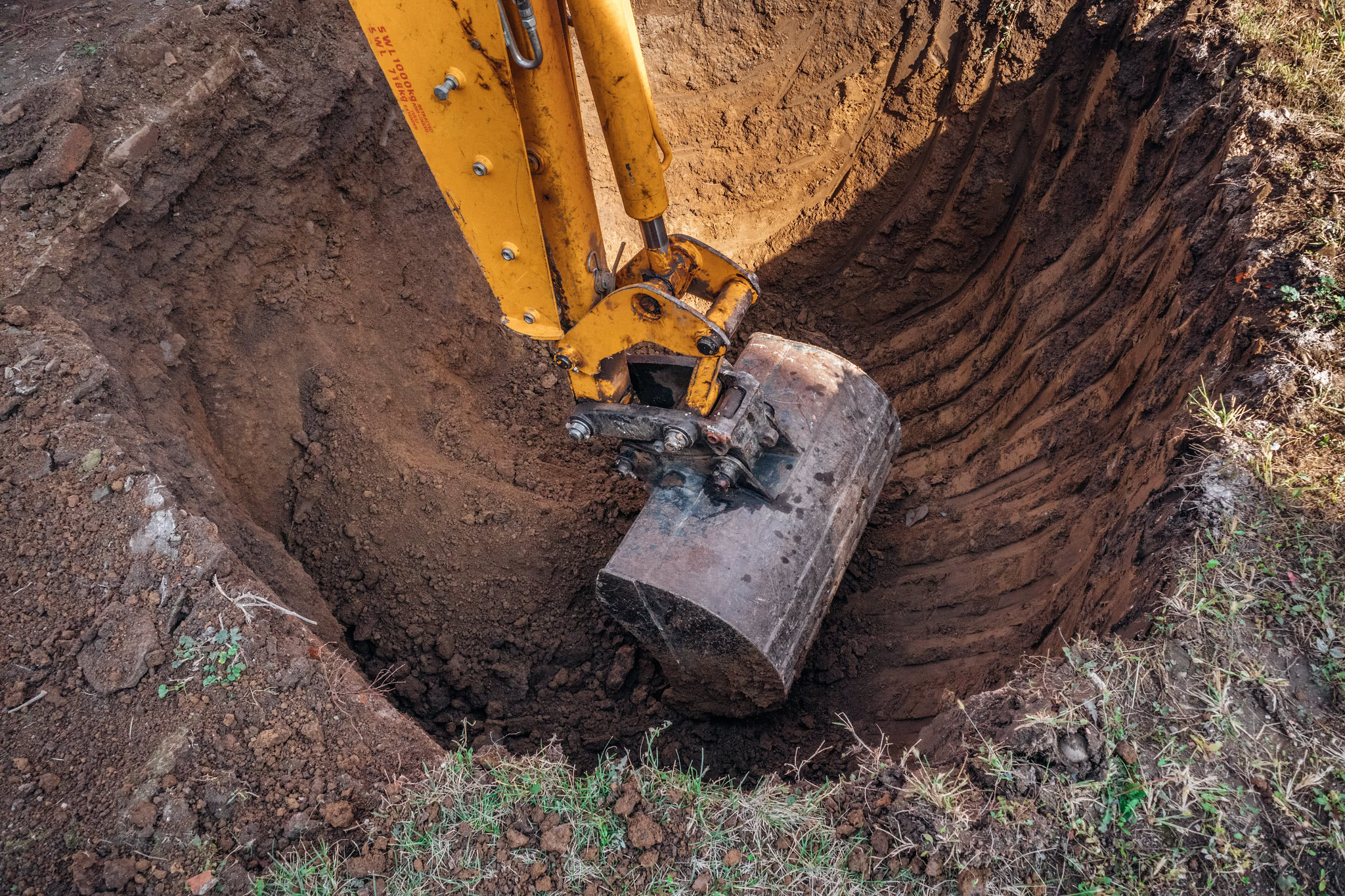 '[Close up of a modern excavator bucket digging a hole in the ground](https://flickr.com/photos/26344495@N05/50516511398 "Close up of a modern excavator bucket digging a hole in the ground") by [Ivan Radic](https://flickr.com/people/26344495@N05) is licensed under [CC BY](https://creativecommons.org/licenses/by/2.0/)'