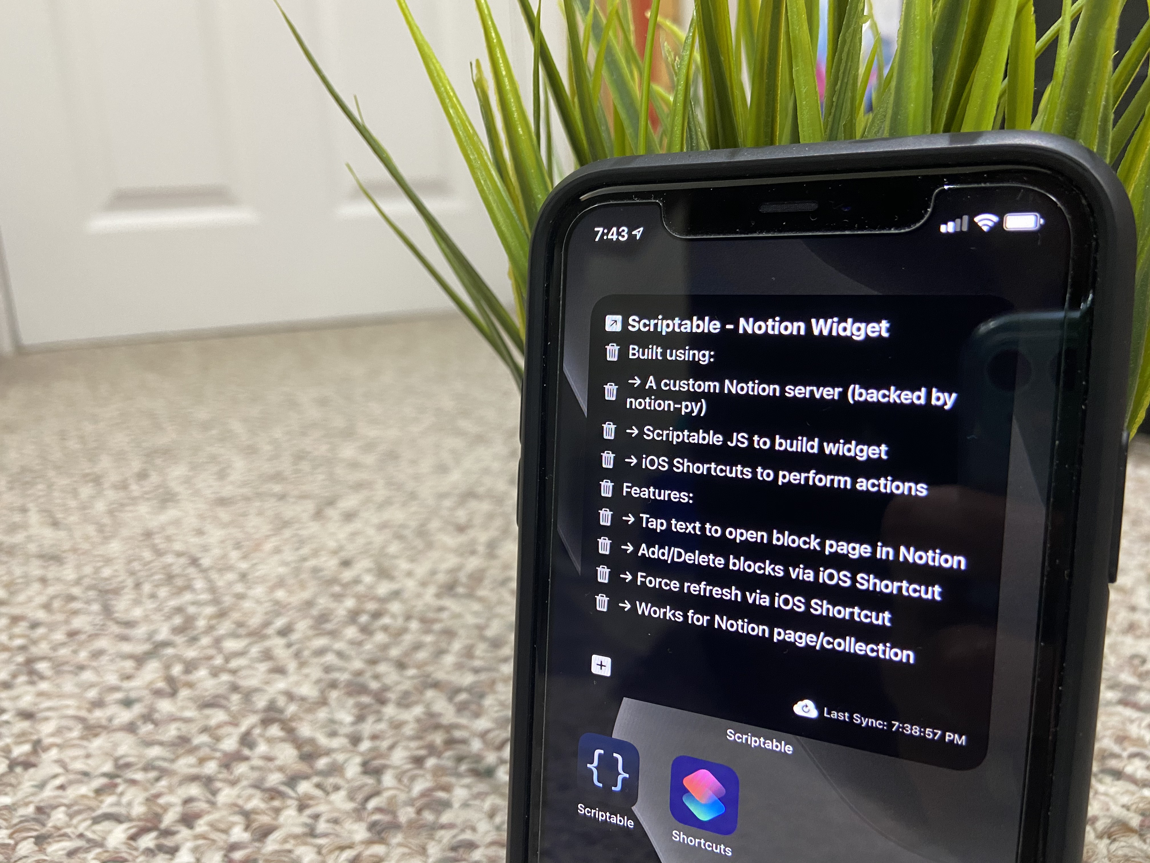 'Photo of my iPhone 11 showing my custom Notion iOS widget'